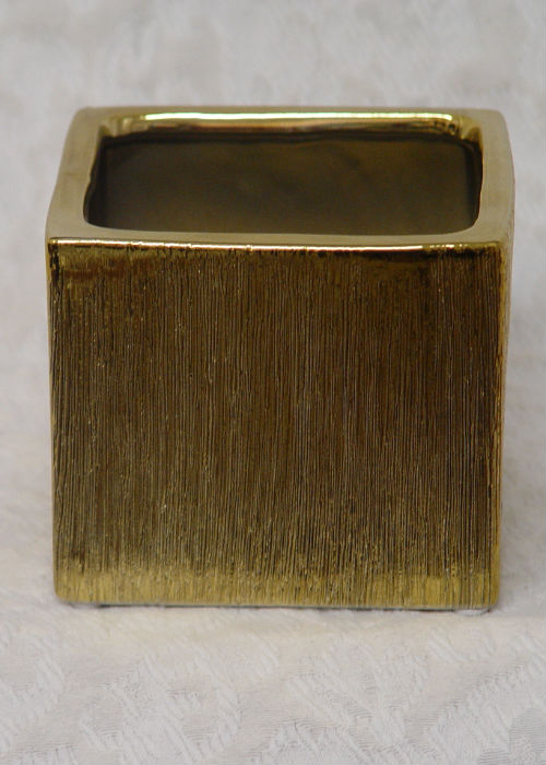 A 4 inch tall Gold Etched Ceramic Cube