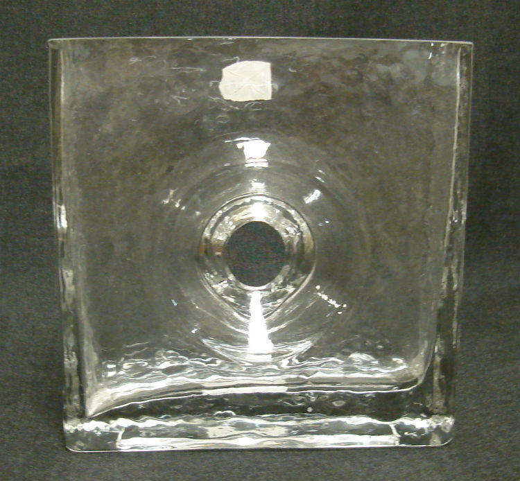 Clear rippled glass rectangular vase with hole in center.