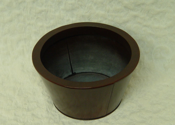 Large tapered metal cylinder